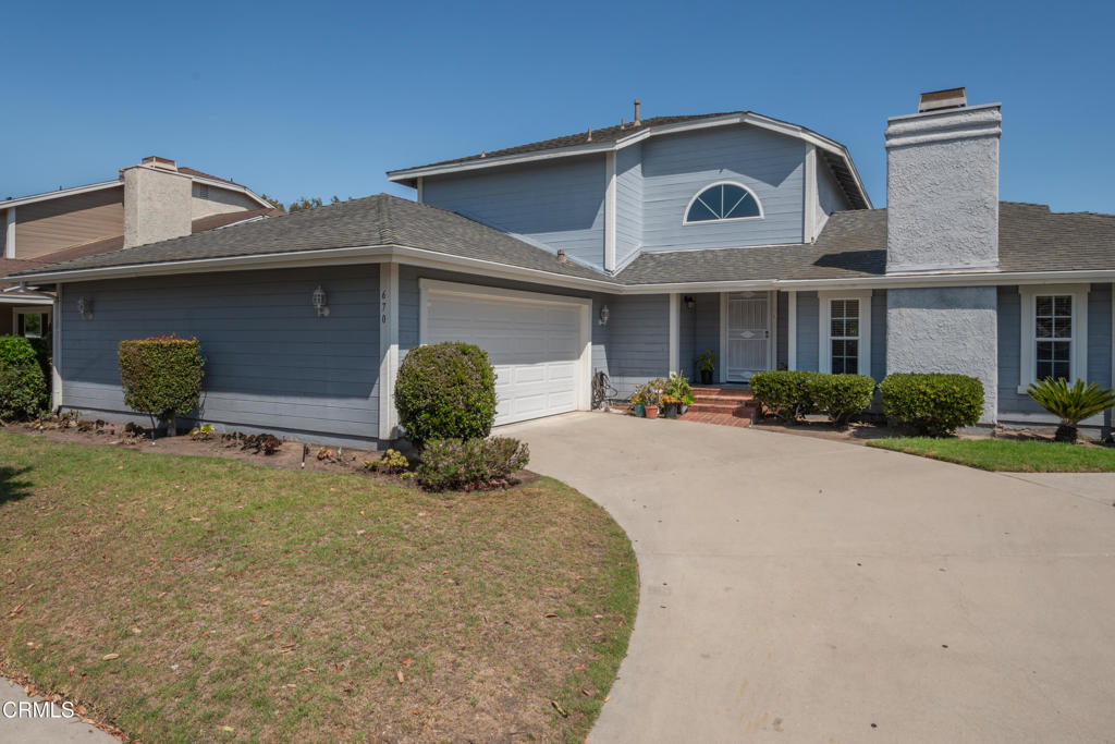 670 Joliet Place Oxnard, CA 93030 - Photo 2 of 33 a front view of a house with garden