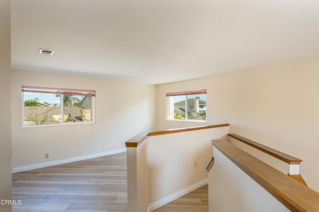 670 Joliet Place Oxnard, CA 93030 - Photo 21 of 33 a view of hallway with window and wooden floor