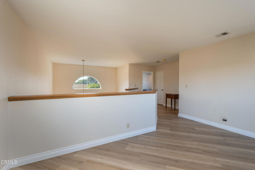 670 Joliet Place Oxnard, CA 93030 - Photo 22 of 33 a view of an empty room with wooden floor and a window
