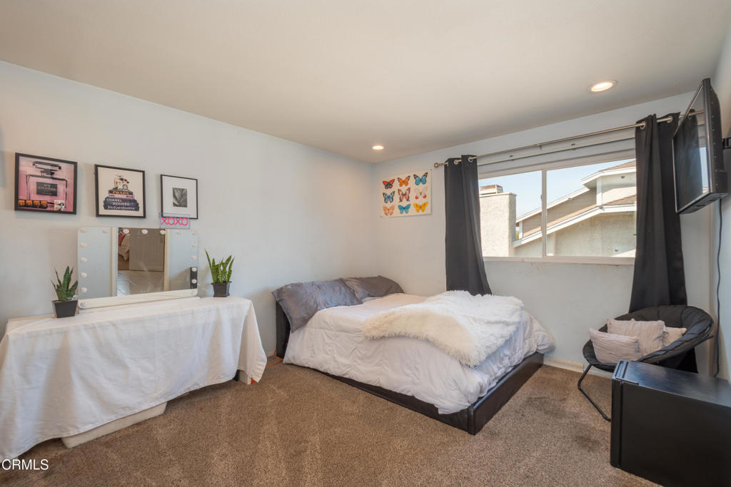 670 Joliet Place Oxnard, CA 93030 - Photo 23 of 33 a bedroom with two beds and a large window