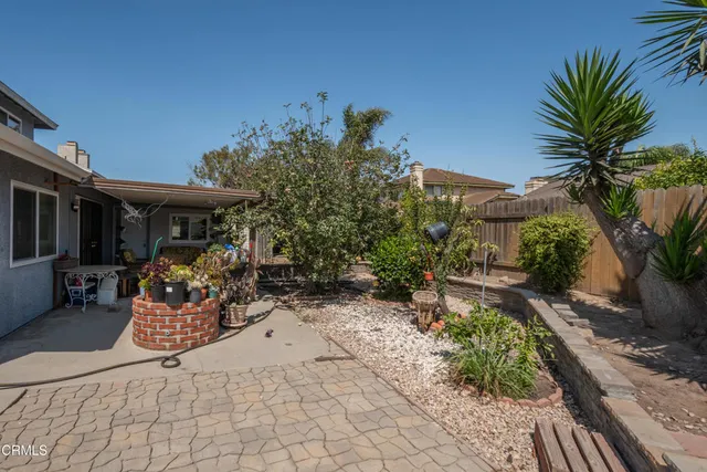 a view of a chairs and table in the patio