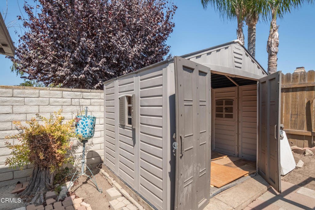 670 Joliet Place Oxnard, CA 93030 - Photo 29 of 33 a view of a house with a potted plant and a large window