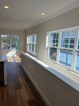 a view of a house with wooden floor and a window