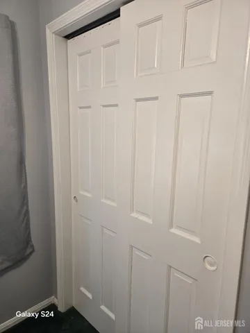 a bedroom with bed and window