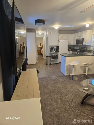 a lobby with furniture and a view of living room