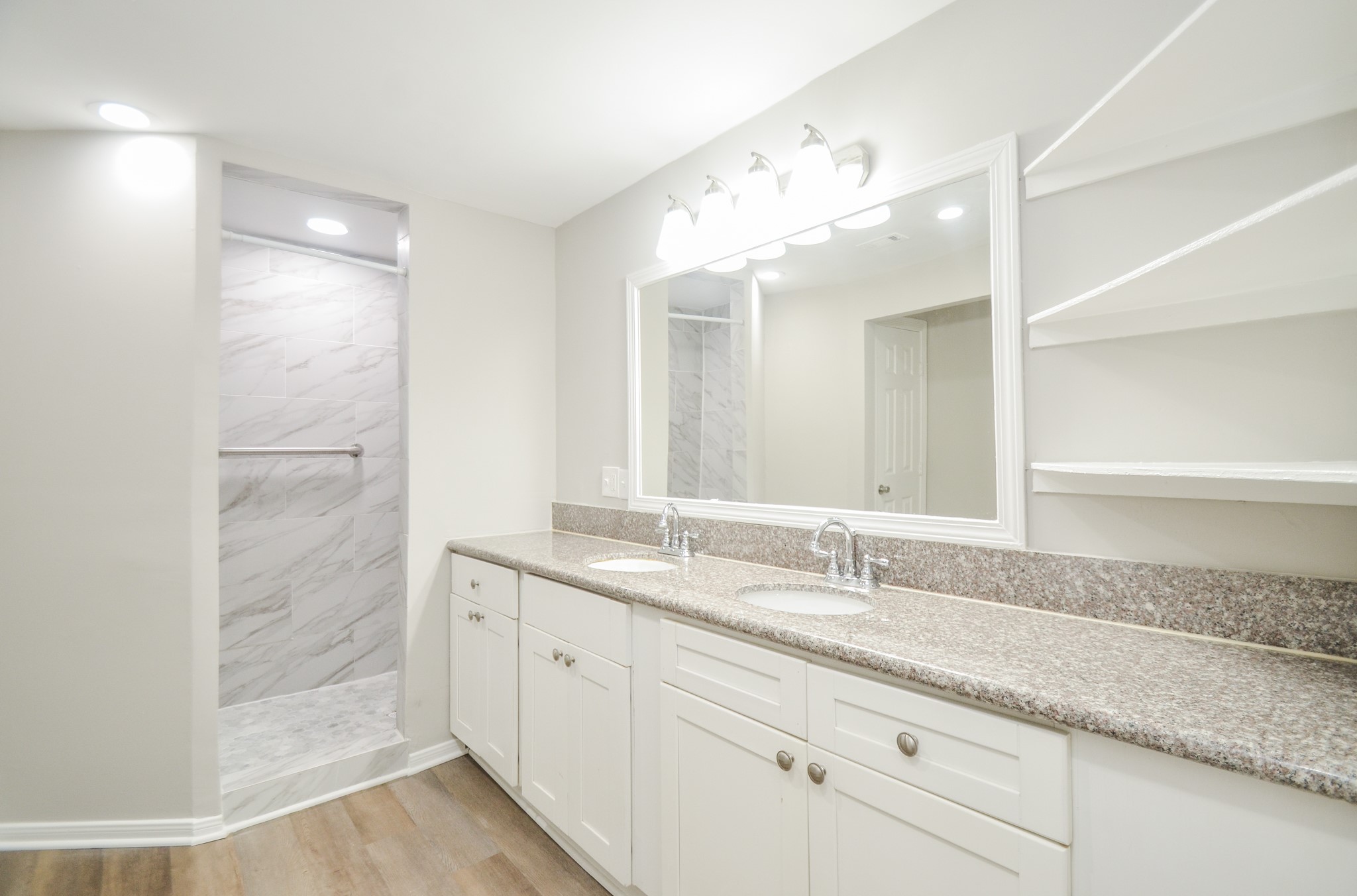 5238 Keystone Street Houston, TX 77021 - Photo 19 of 31 Bathroom with dual sinks and built-in open shelving.