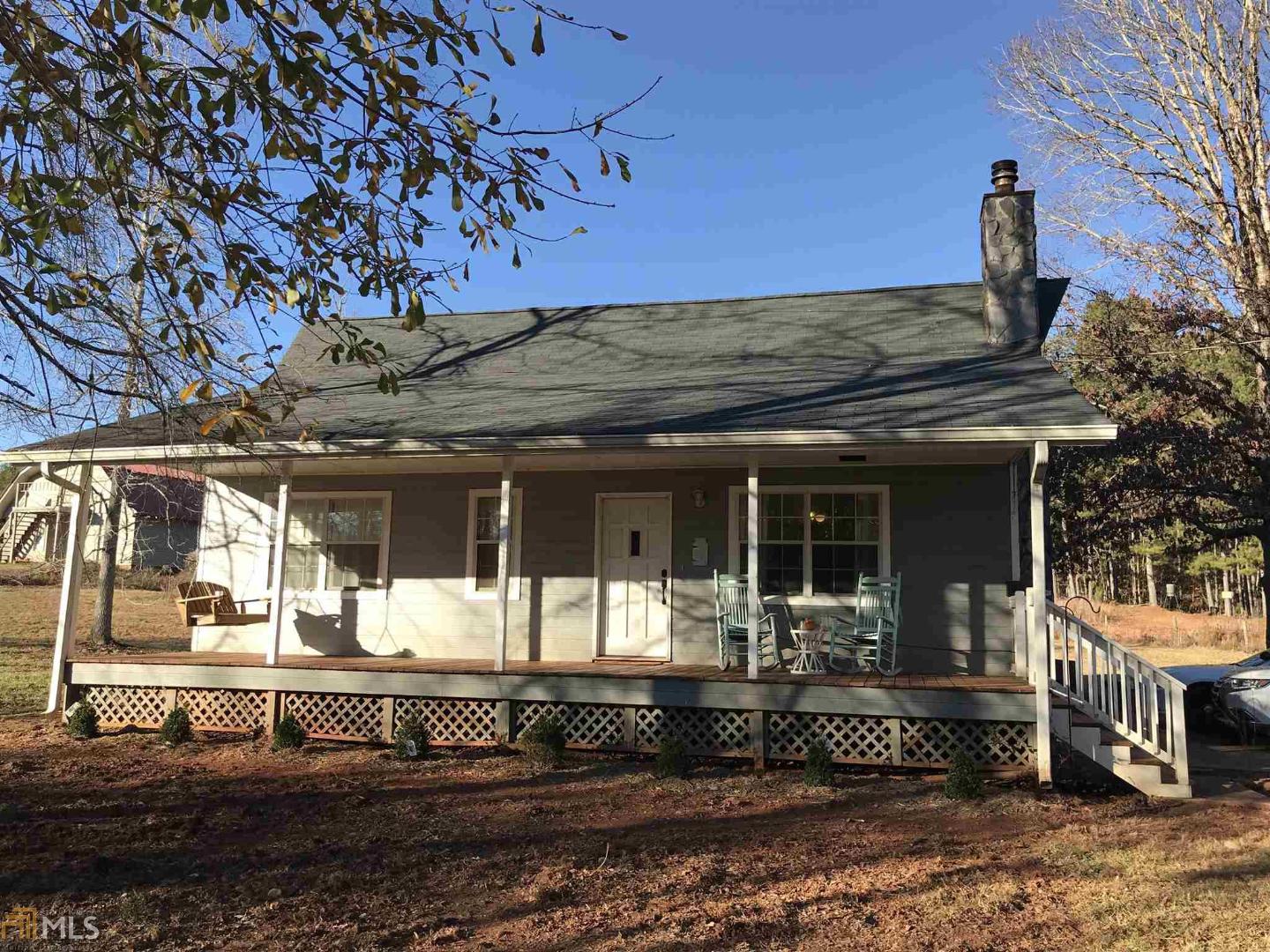 570 King Bostick Road Covington, GA 30016 - Photo 1 of 1 a front view of a house with a porch