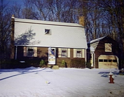 8 North Hunt Road Amesbury, MA 01913 - Photo 1 of 1 a front view of a house with a yard