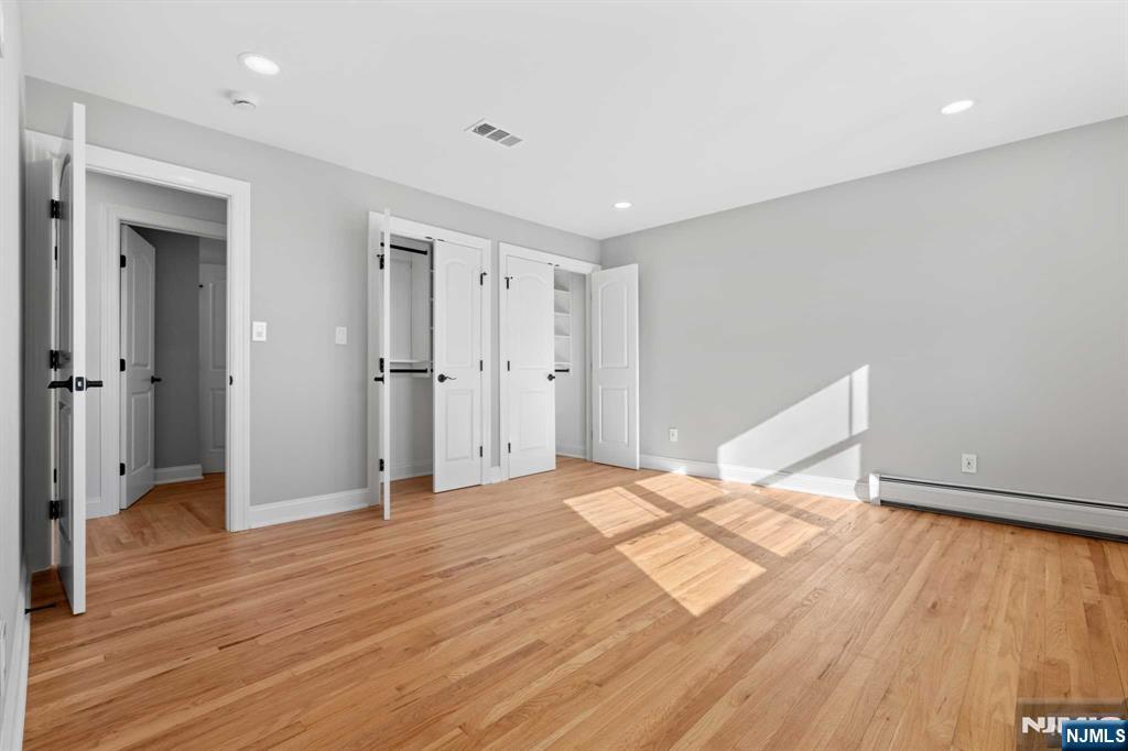 743 7th Street, Unit 1 Carlstadt, NJ 07072 - Photo 14 of 23 a room that has a bed in it