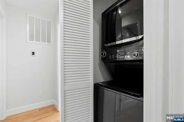 a view of a brick house with many windows