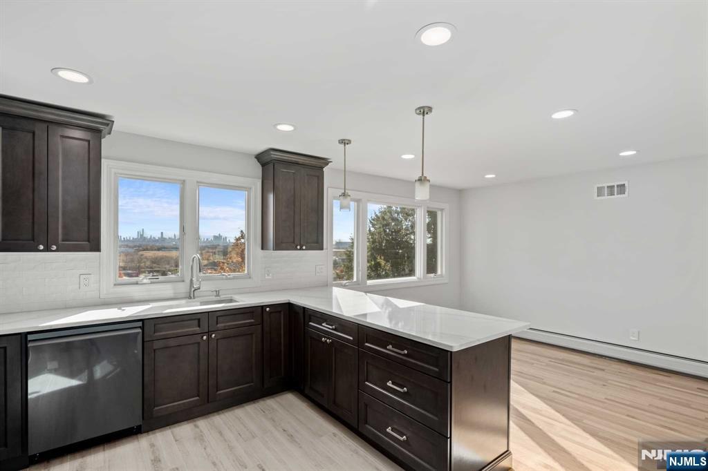 743 7th Street, Unit 1 Carlstadt, NJ 07072 - Photo 3 of 23 a kitchen with a sink and cabinets