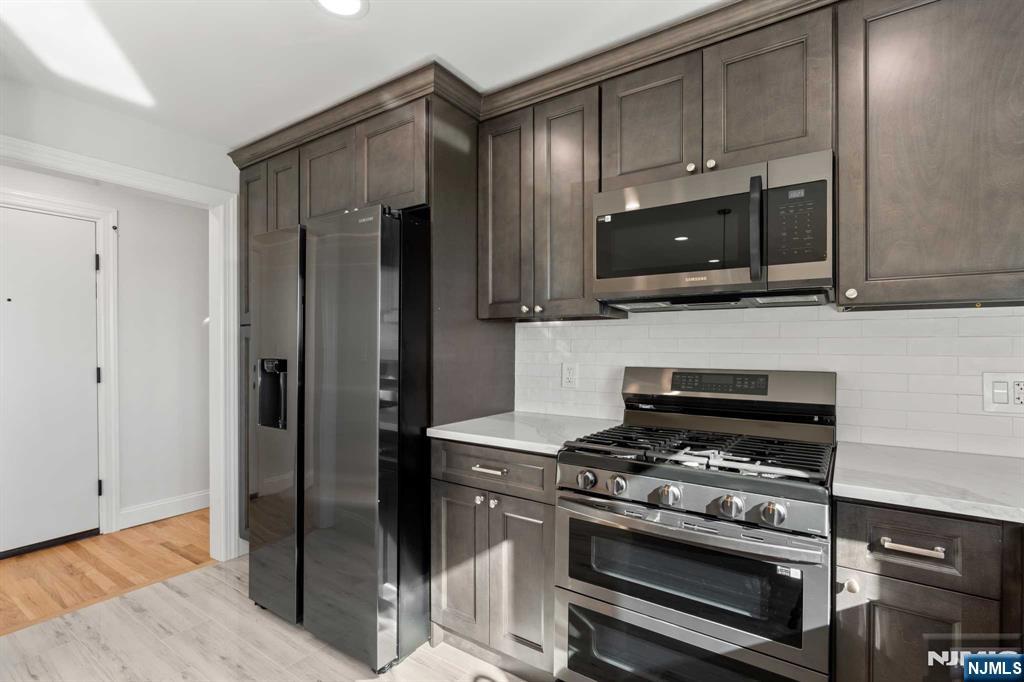743 7th Street, Unit 1 Carlstadt, NJ 07072 - Photo 4 of 23 a kitchen with appliances a sink and cabinets