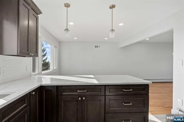 a kitchen with a sink and a large window