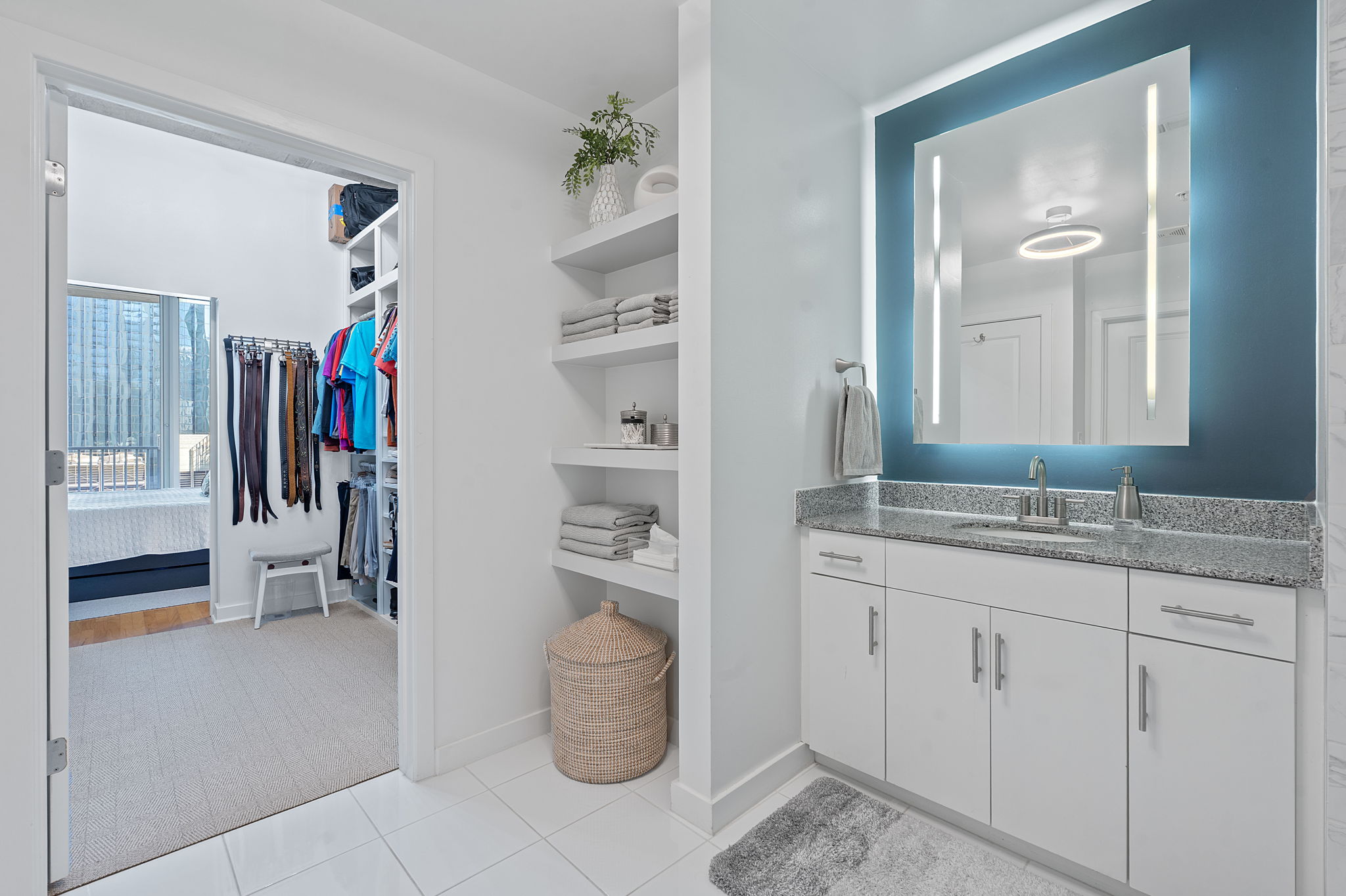 360 Nueces Street, Unit 1007 Austin, TX 78701 - Photo 24 of 40 Full bath with vanity, a spacious closet, ensuite bathroom, and light tile patterned flooring