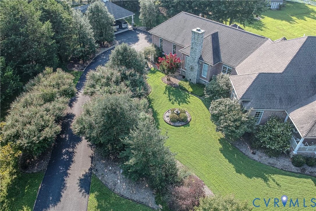 2365 State Rte 635 Midlothian, VA 23113 - Photo 4 of 64 Brick exterior with a stone chimney, extensive gre