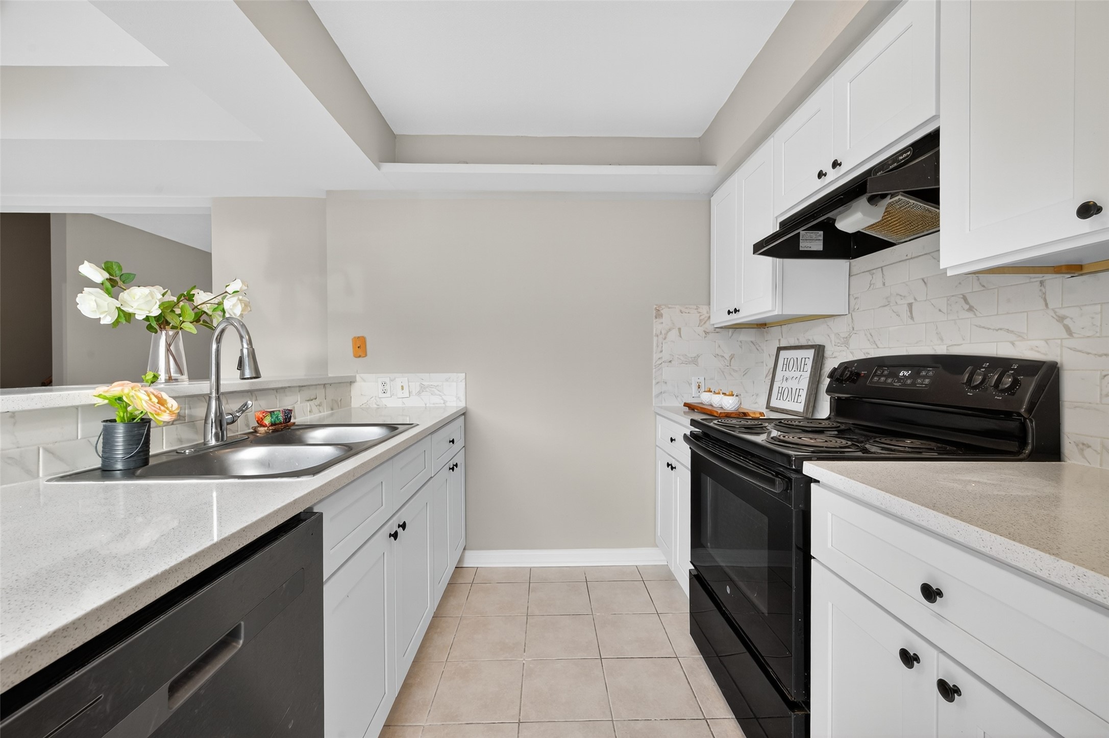 1445 Bonanza Road, Unit 445 Houston, TX 77062 - Photo 14 of 34 a kitchen with a sink stove and microwave