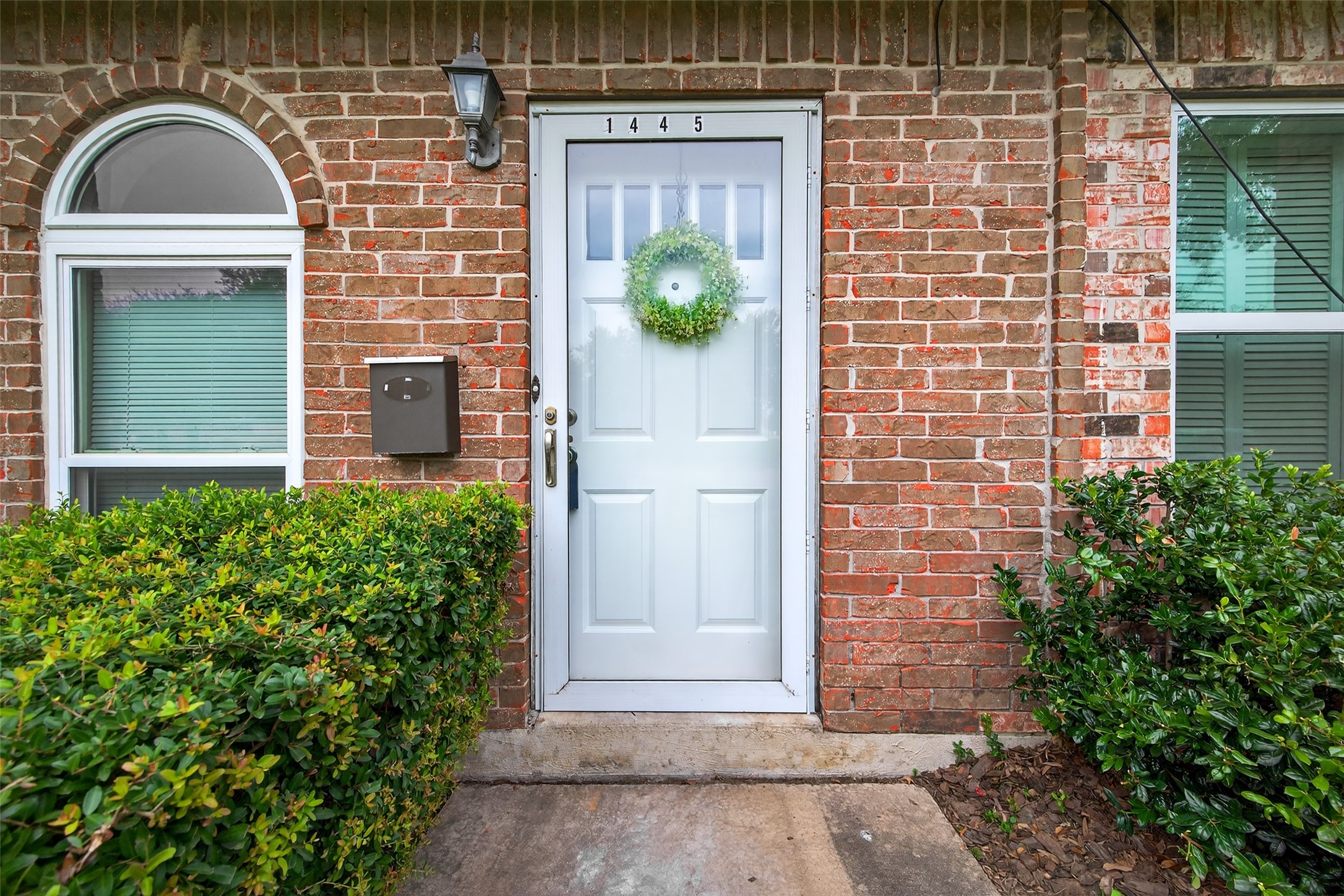 1445 Bonanza Road, Unit 445 Houston, TX 77062 - Photo 2 of 34 a front view of a house with garden