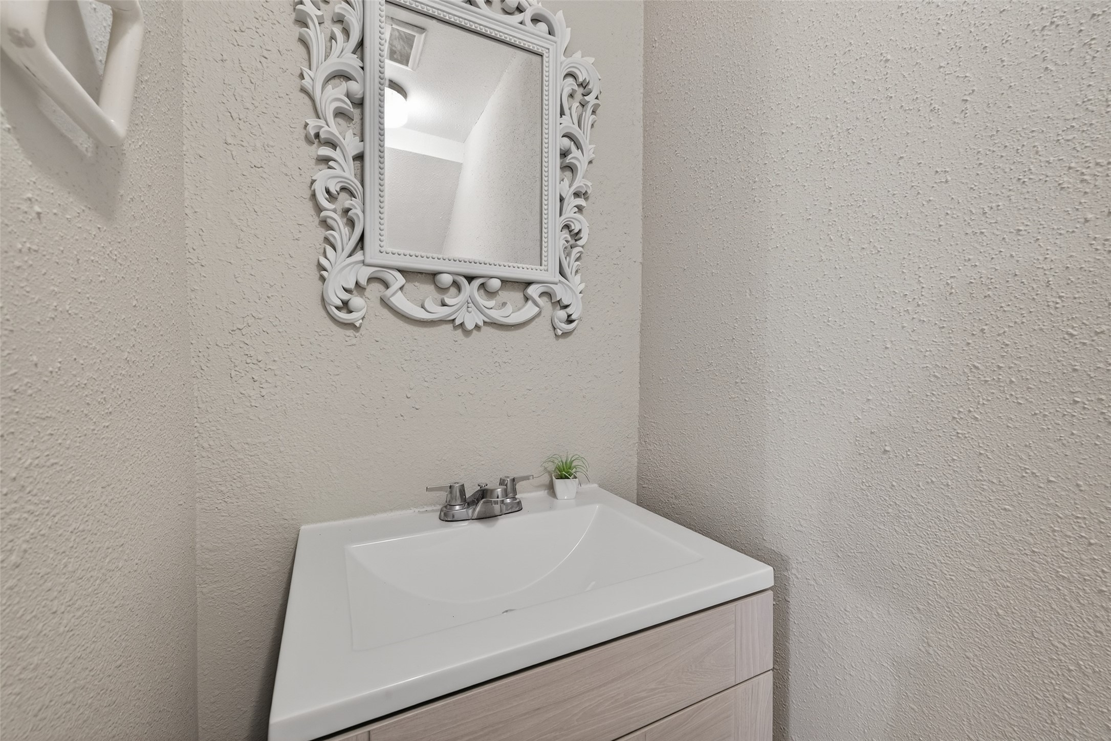 1445 Bonanza Road, Unit 445 Houston, TX 77062 - Photo 21 of 34 a bathroom with a sink and vanity