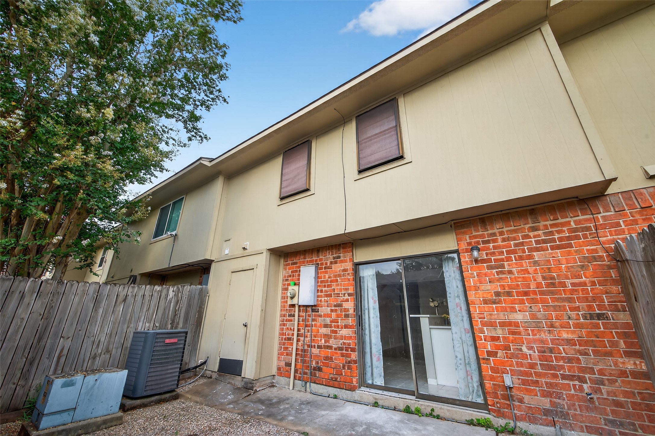 1445 Bonanza Road, Unit 445 Houston, TX 77062 - Photo 33 of 34 a front view of a house with large windows