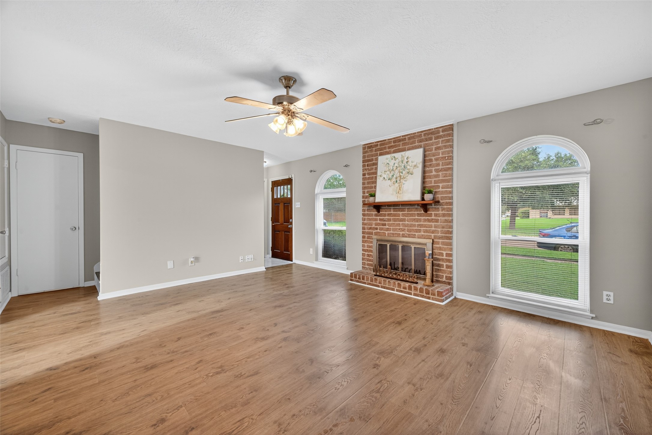 1445 Bonanza Road, Unit 445 Houston, TX 77062 - Photo 6 of 34 a view of an empty room with a window and wooden floor