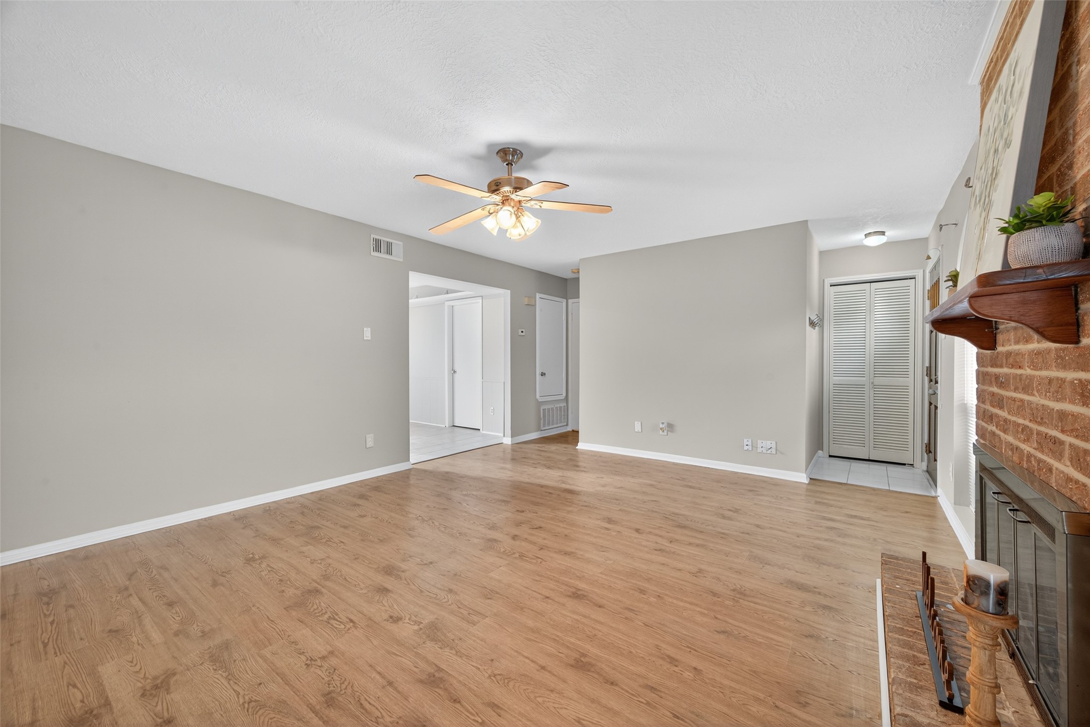 1445 Bonanza Road, Unit 445 Houston, TX 77062 - Photo 7 of 34 wooden floor in an empty room with a window