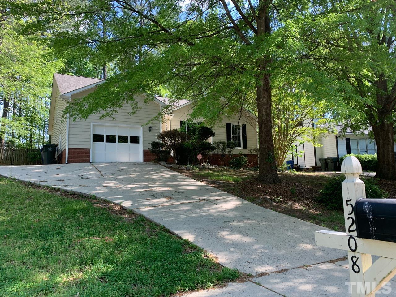 5208 Wallingford Drive Raleigh, NC 27616 - Photo 1 of 15 a view of a house with backyard and sitting area