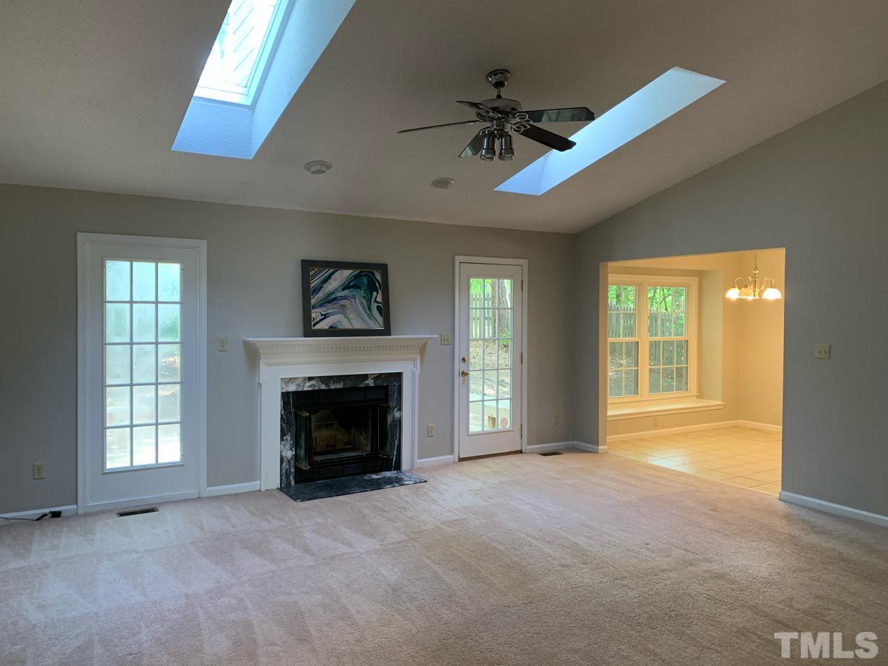 5208 Wallingford Drive Raleigh, NC 27616 - Photo 4 of 15 a view of empty room with a fireplace