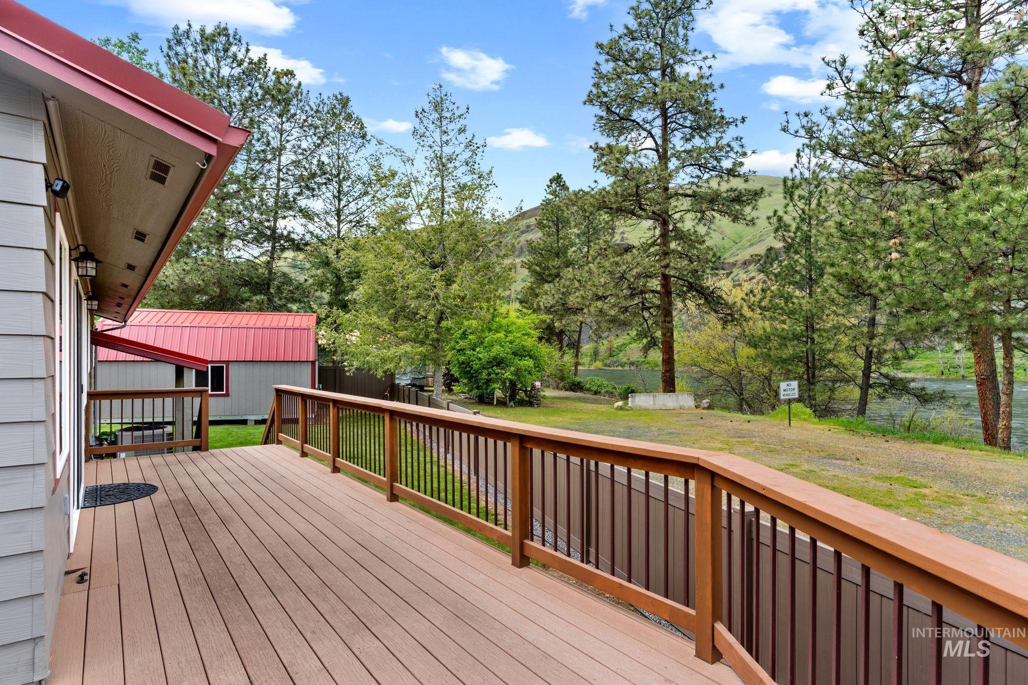 20015 Clark Street Juliaetta, ID 83535 - Photo 37 of 46 Spacious outdoor deck with wood railing, providing an outdoor living area.