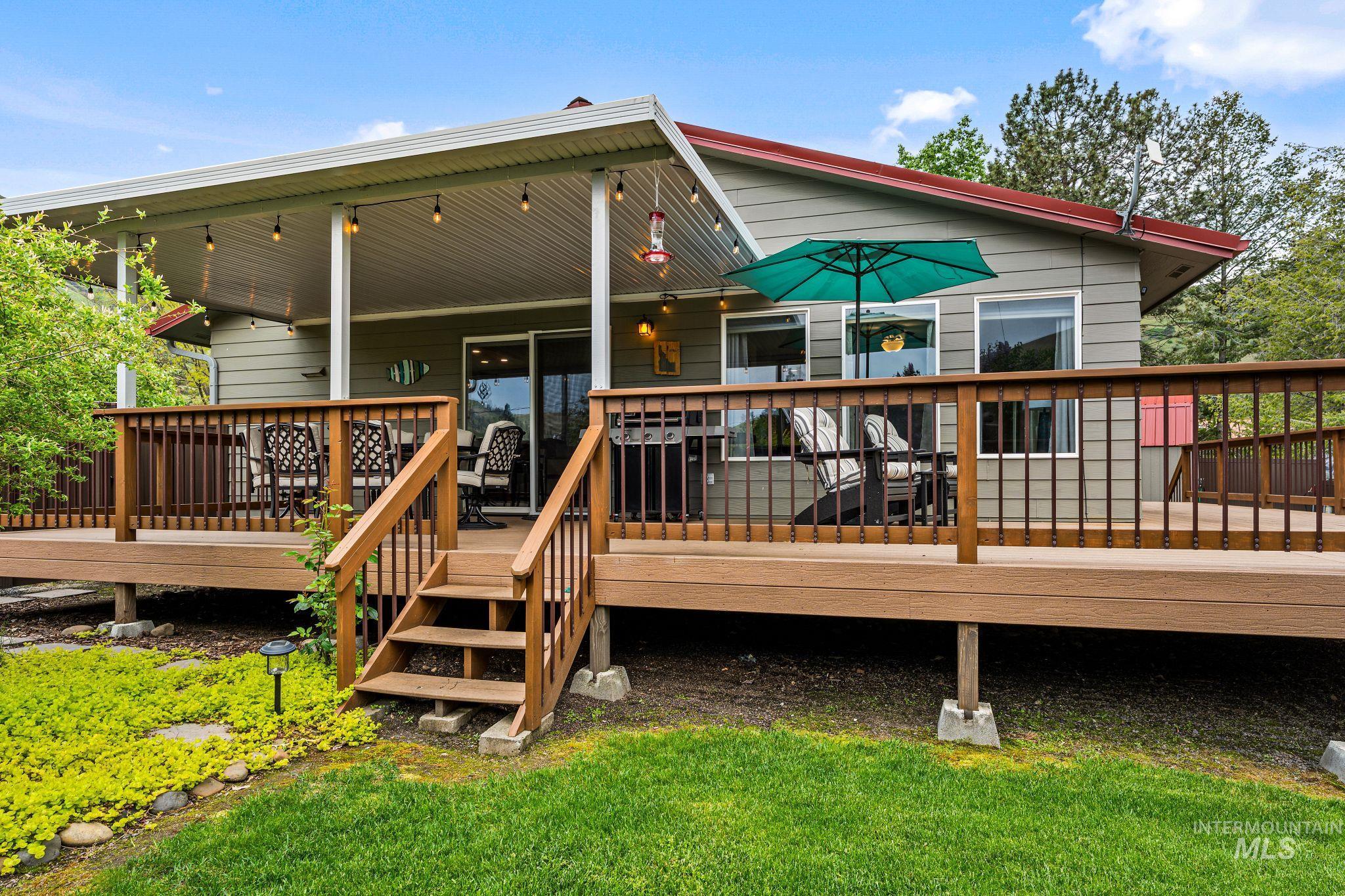 20015 Clark Street Juliaetta, ID 83535 - Photo 5 of 46 Expansive multi-level wood-finish deck with a covered patio area