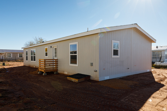 749 Riddle Drive Fredonia, AZ 86022 - Photo 31 of 41 Rear view of house with crawl space