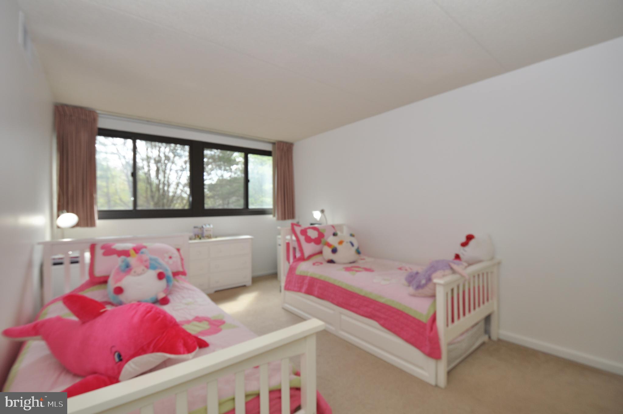 5911 Edsall Road, Unit 403 Alexandria, VA 22304 - Photo 14 of 29 a bedroom with baby bed and windows