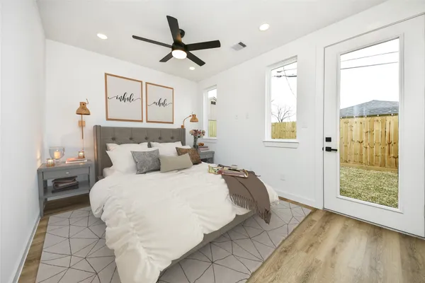 a bedroom with a bed and a window