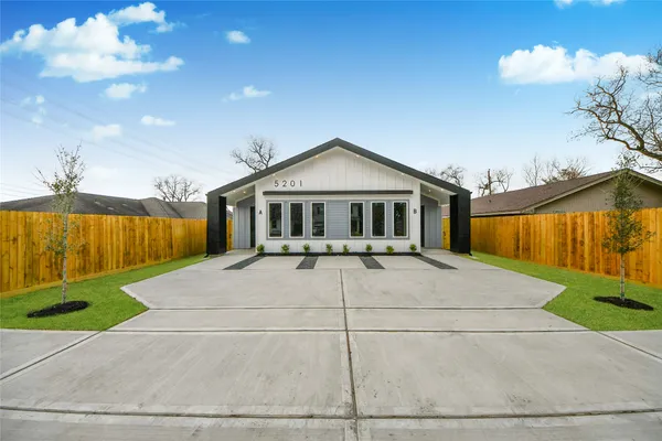 a house view with a garden space