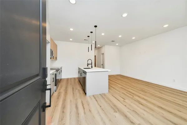 a view of kitchen with wooden floor
