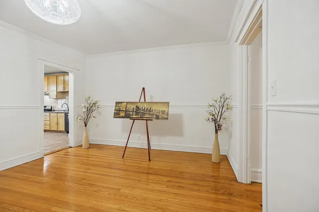 a view of a room with wooden floor and closet