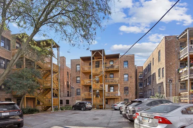 a city street lined with buildings and cars