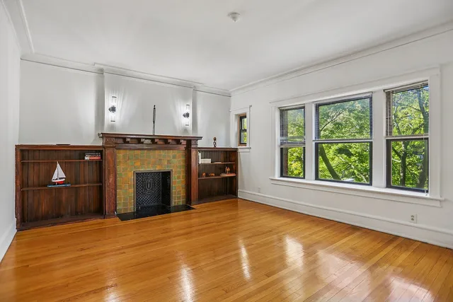 a view of a kitchen with a stove cabinets and a large window