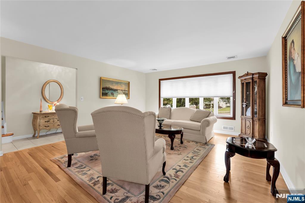23 Ridge Court Cedar Grove, NJ 07009 - Photo 5 of 37 a living room with furniture and a large window