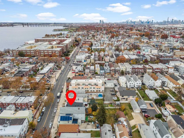 an aerial view of residential building and lake