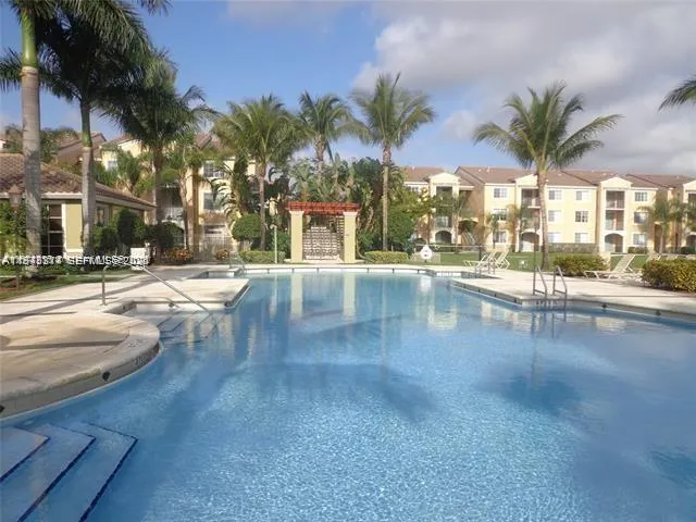 a view of a swimming pool with a patio