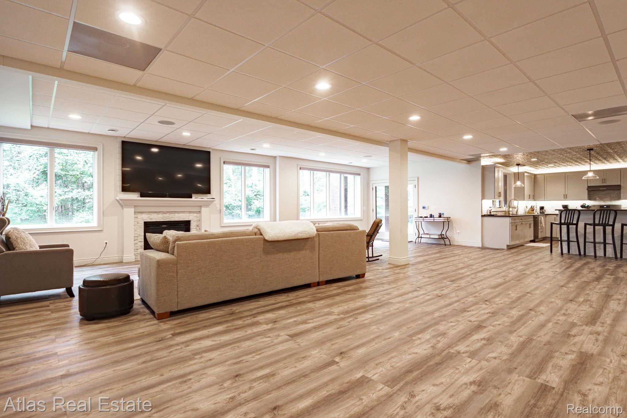 10380 South State Road Goodrich, MI 48438 - Photo 76 of 87 Spacious open-concept living area featuring wood-finish flooring, recessed lighting, and a drop ceiling