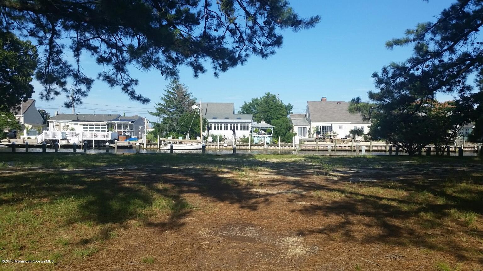 104 Mermaid Road Toms River, NJ 08753 - Photo 1 of 4 a view of a town with large trees
