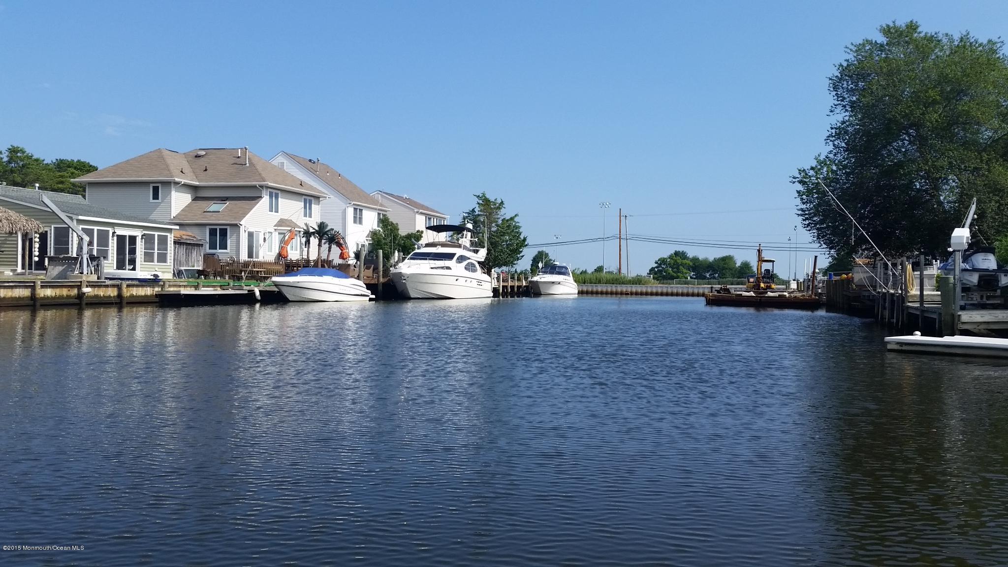 104 Mermaid Road Toms River, NJ 08753 - Photo 2 of 4 a view of a lake with houses