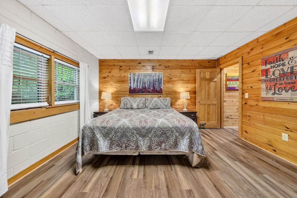 149 Mountain Springs Road Warm Springs, GA 31830 - Photo 24 of 43 a bedroom with a large bed and a large window with outer view