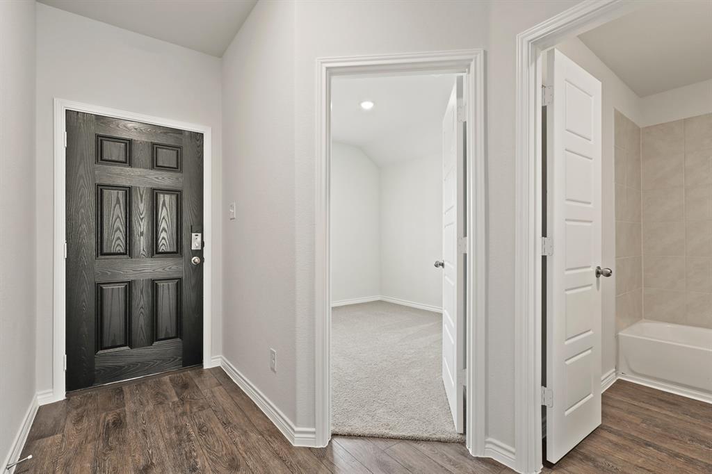 3117 Harmony Way Cleburne, TX 76031 - Photo 3 of 20 a view of a hallway with wooden floor and closet