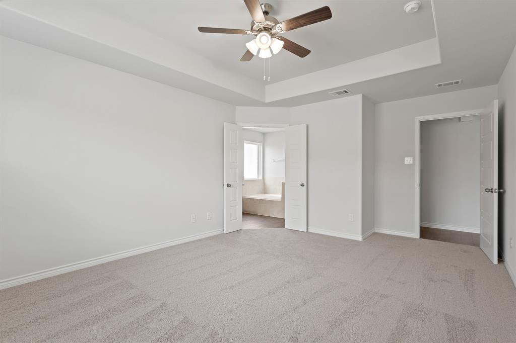 3117 Harmony Way Cleburne, TX 76031 - Photo 9 of 20 a view of an empty room and a ceiling fan window