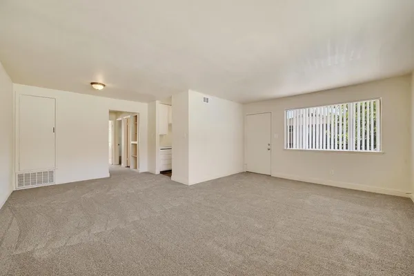 a view of an empty room with a window