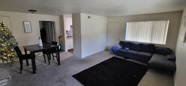 a living room with furniture and a window