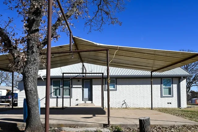 a view of a house with a street