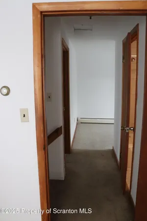 a bath tub sitting next to a white toilet